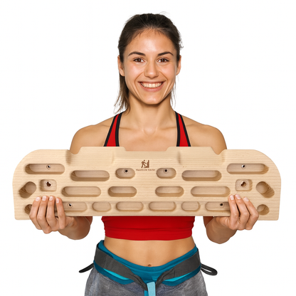 girl holding a wooden climbing hangboard