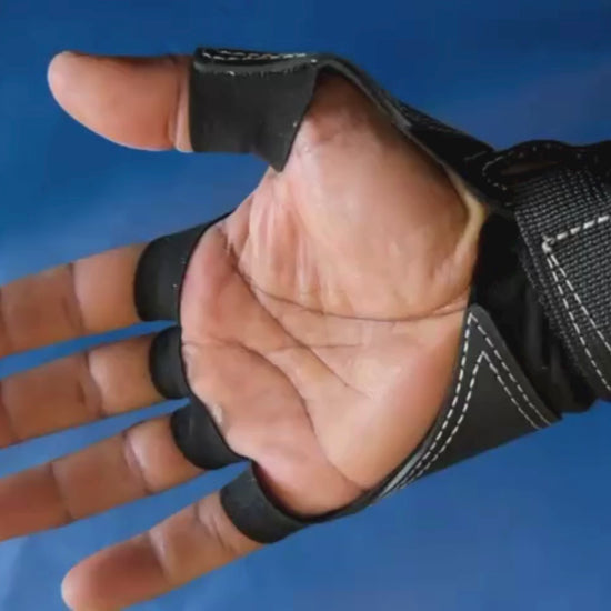 a person rock climbing using crack climbing gloves